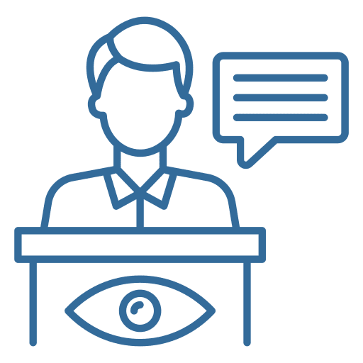 A person is sitting at a table with an eye on the table.